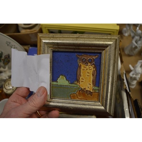 581 - A group of tile pictures, mostly framed and glazed.