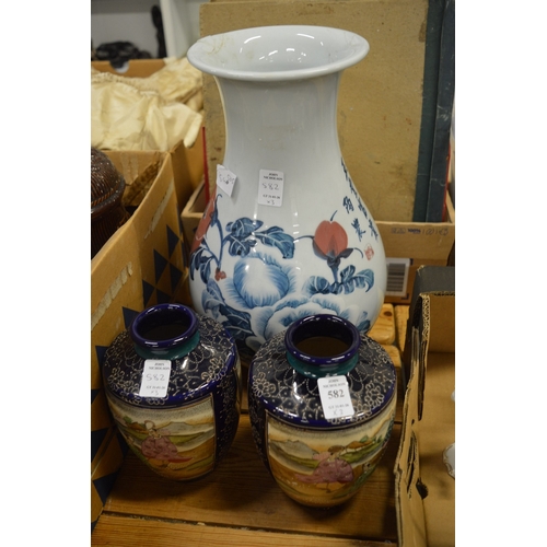 582 - A pair of Satsuma vases and a Japanese vase (rim damage).