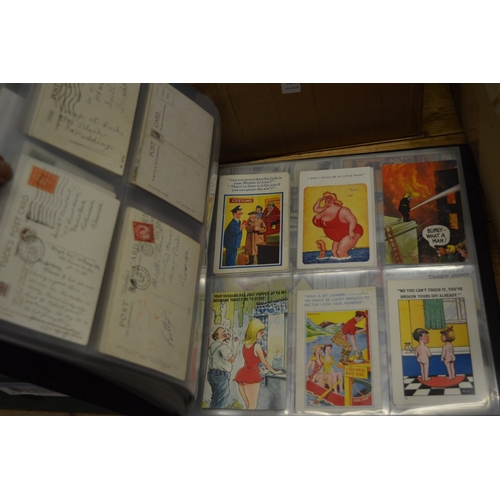 585 - An album containing a good collection of saucy postcards.