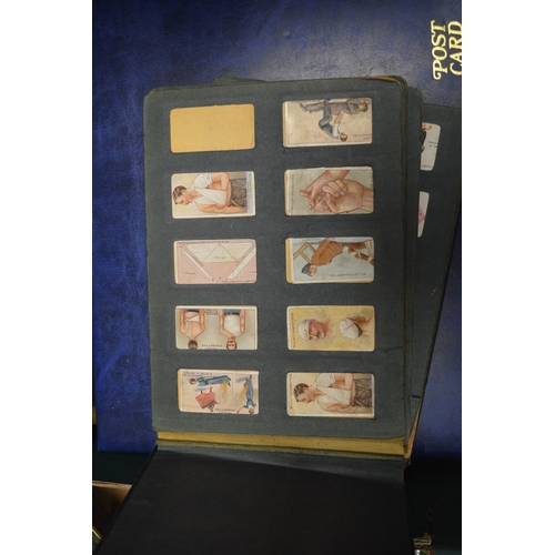 586 - A collection of cigarette cards in albums plus loose cards and The Topical Times Panel Portrait albu... 