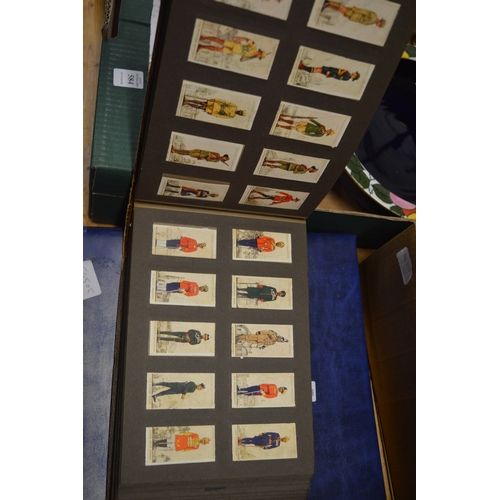 586 - A collection of cigarette cards in albums plus loose cards and The Topical Times Panel Portrait albu... 