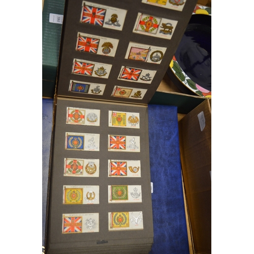 586 - A collection of cigarette cards in albums plus loose cards and The Topical Times Panel Portrait albu... 