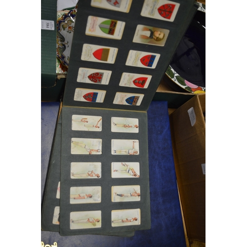 586 - A collection of cigarette cards in albums plus loose cards and The Topical Times Panel Portrait albu... 