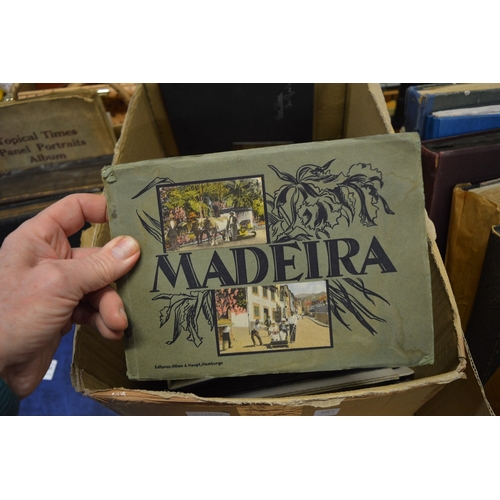 587 - A quantity of postcard albums and contents together with loose postcards.