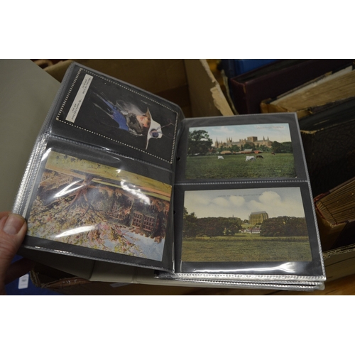 587 - A quantity of postcard albums and contents together with loose postcards.