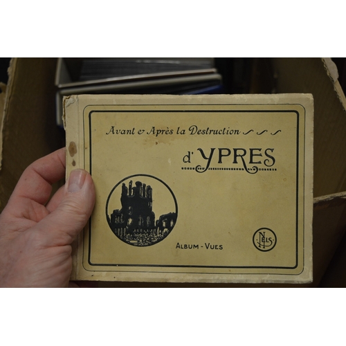 587 - A quantity of postcard albums and contents together with loose postcards.