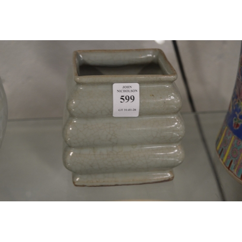 599 - A Chinese celadon glazed square shaped vase with ribbed body.