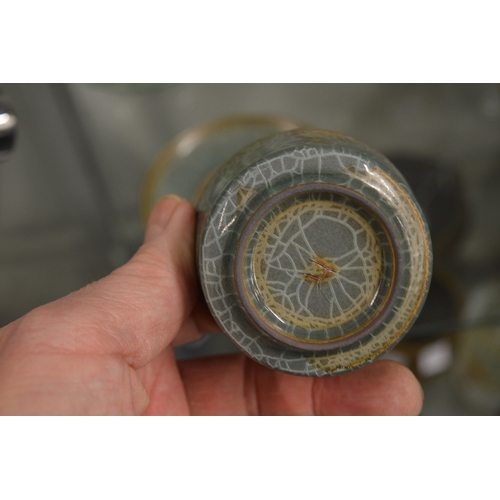 601 - A small Chinese crackle glazed tea bowl and stand.