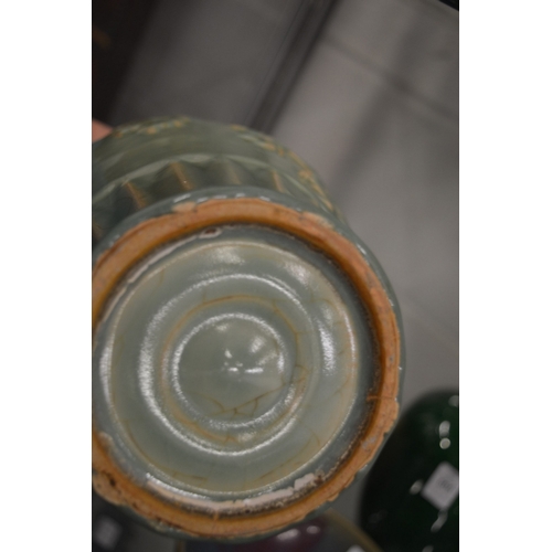 604 - A large Chinese celadon glazed vase with four strap work handles.