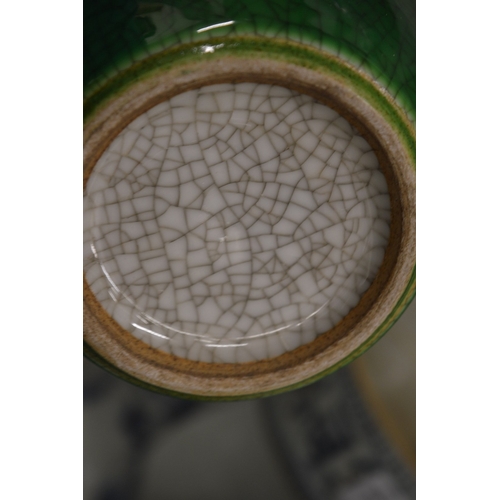 606 - A Chinese green crackle glazed vase.