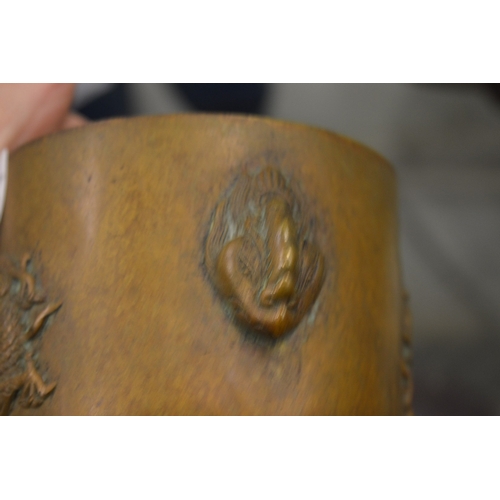 612 - A Chinese bronze censer cast with a dragon.