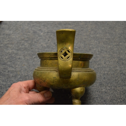 619 - A Chinese bronze twin handled censer with six character mark to the base.