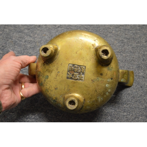 619 - A Chinese bronze twin handled censer with six character mark to the base.