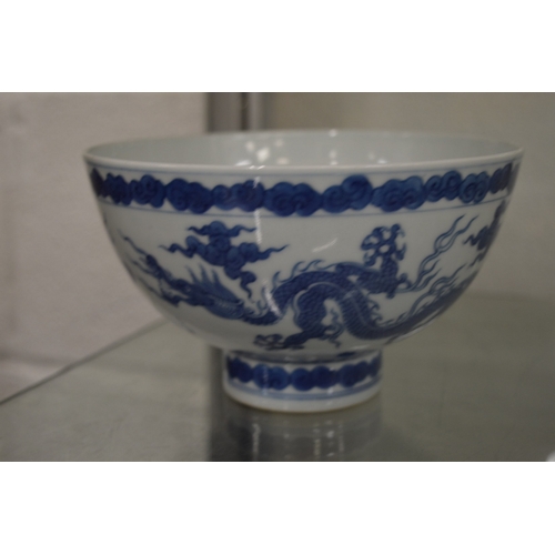625 - A good Chinese blue and white dragon bowl with four character mark to the base.