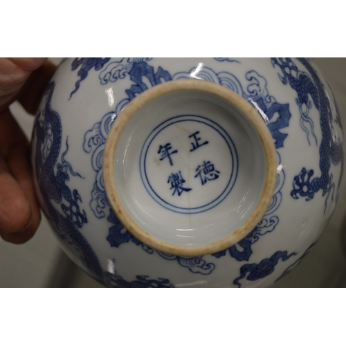 625 - A good Chinese blue and white dragon bowl with four character mark to the base.