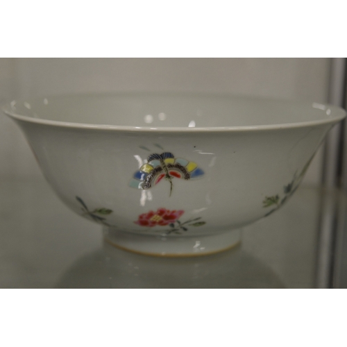 629 - A good Chinese circular bowl painted with flowers, six character mark to the base.