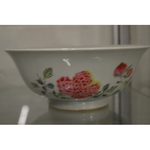 629 - A good Chinese circular bowl painted with flowers, six character mark to the base.