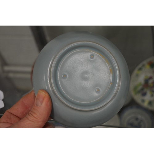 630 - A Chinese small circular shallow dish.