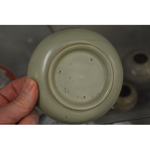 631 - A Chinese small circular shallow dish.