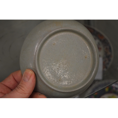 632 - A Chinese small circular shallow dish.