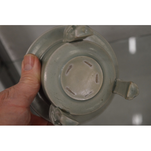 633 - A Chinese circular censer on three feet.