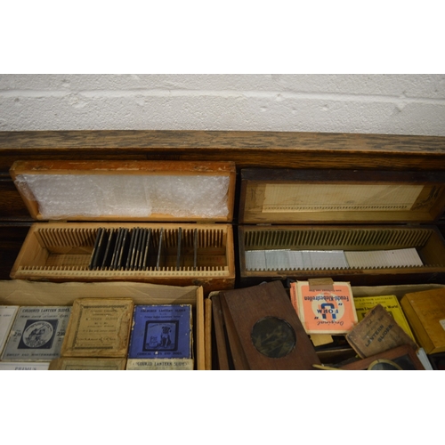 639 - A good Victorian brass and mahogany slide projector, converted to electricity complete with numerous... 