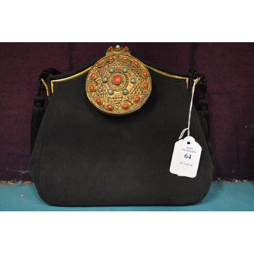 64 - A black fabric evening bag, the decorative clasp combined with a small mirror.