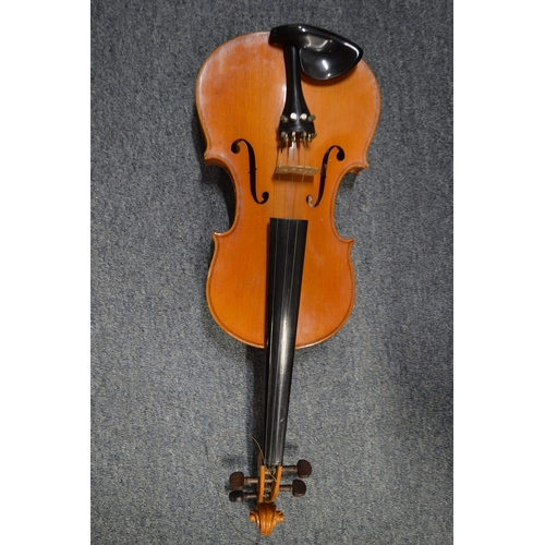 648 - A violin and four various bows.