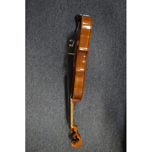 648 - A violin and four various bows.