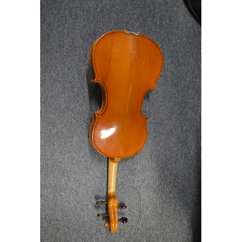 648 - A violin and four various bows.