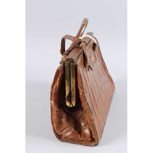482 - AN EARLY GUCCI CROCODILE SKIN BAG. 13ins long.