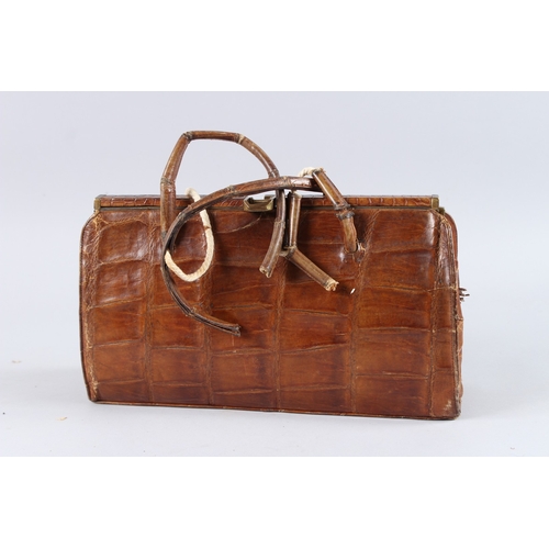 482 - AN EARLY GUCCI CROCODILE SKIN BAG. 13ins long.