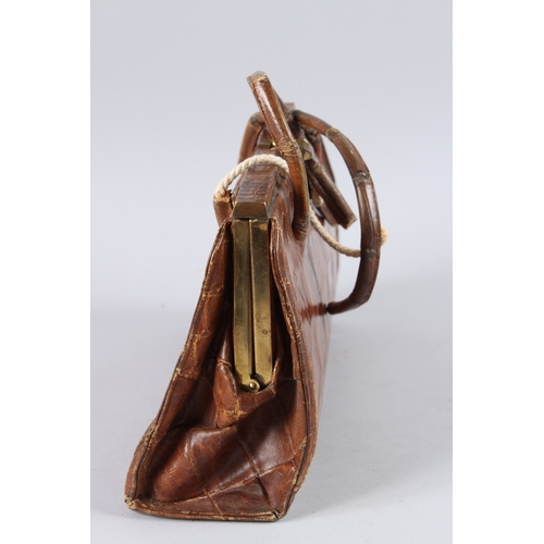 482 - AN EARLY GUCCI CROCODILE SKIN BAG. 13ins long.