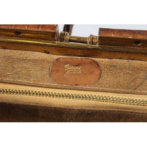 482 - AN EARLY GUCCI CROCODILE SKIN BAG. 13ins long.