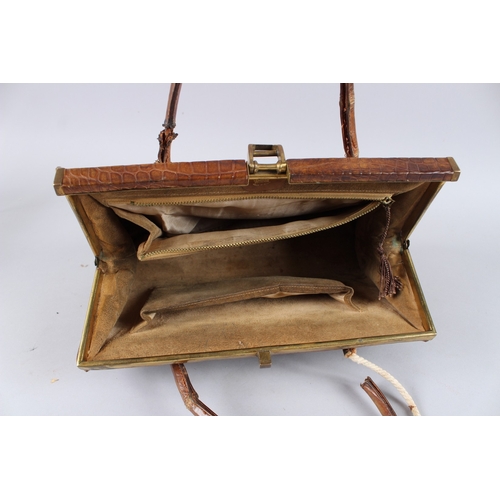 482 - AN EARLY GUCCI CROCODILE SKIN BAG. 13ins long.