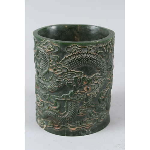 484 - A CHINESE CARVED JADE BRUSHPOT. 15cms high.