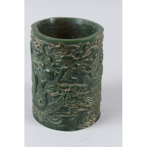 484 - A CHINESE CARVED JADE BRUSHPOT. 15cms high.