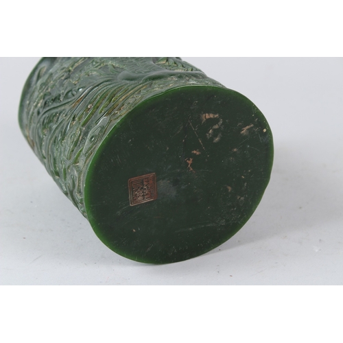 484 - A CHINESE CARVED JADE BRUSHPOT. 15cms high.