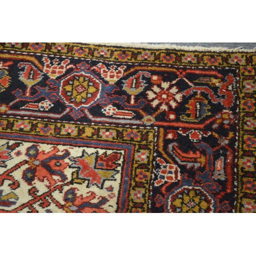 354 - A Persian rug with geometric design (moth damage) 284cm x 192cm.