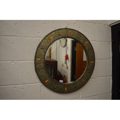 372 - A decorative circular wall mirror.