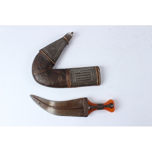 128 - A LARGE 19TH CENTURY ARAB YEMENI JAMBIYA DAGGER with Bakelite handle and silver mounts. 36cms long.... 