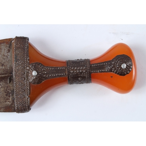 128 - A LARGE 19TH CENTURY ARAB YEMENI JAMBIYA DAGGER with Bakelite handle and silver mounts. 36cms long.... 