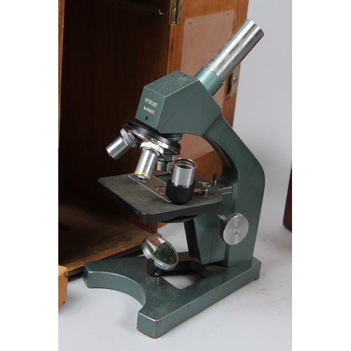 AN EARLY 20TH CENTURY BRASS MICROSCOPE, in a mahogany case; together ...