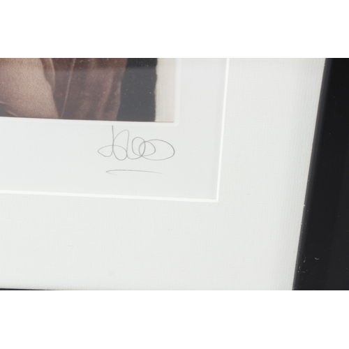 113 - WILLI KISSMER (1951-2018)  Woman in a negligee  print  signed in pencil  57.5 x 27cm