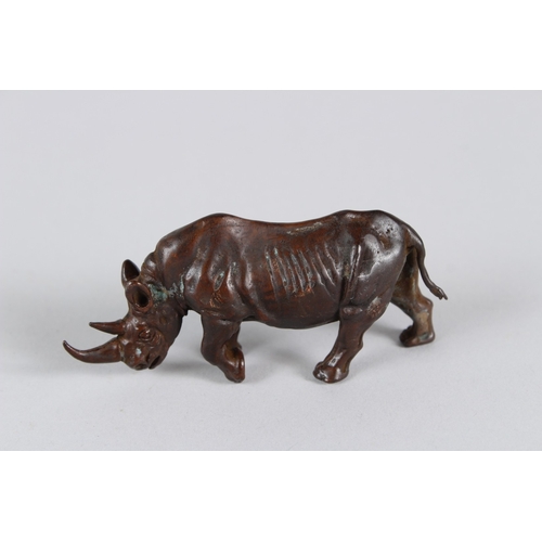 20 - A JAPANESE OKIMONO BRONZE RHINOCEROS.  9cms long.