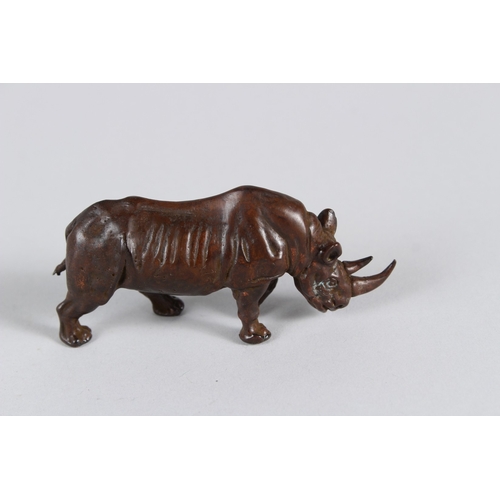 20 - A JAPANESE OKIMONO BRONZE RHINOCEROS.  9cms long.