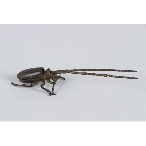 21 - A JAPANESE OKIMONO ARTICULATED LONGHORN BEETLE.  14cms long.