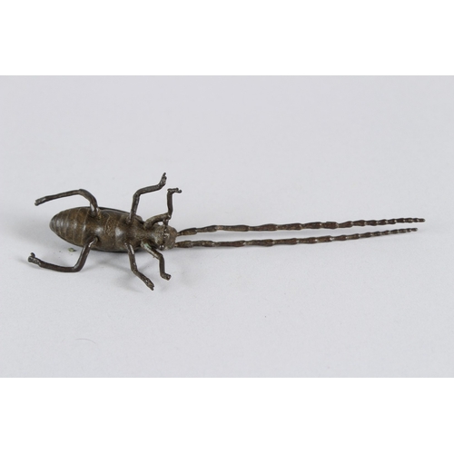 21 - A JAPANESE OKIMONO ARTICULATED LONGHORN BEETLE.  14cms long.