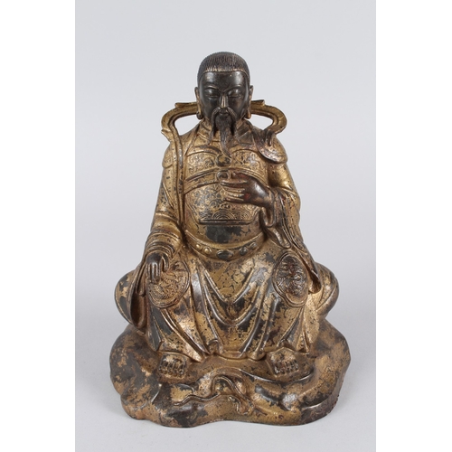 28 - A CHINESE GILT BRONZE STATUE OF GUANDI.  26cms high.