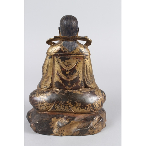 28 - A CHINESE GILT BRONZE STATUE OF GUANDI.  26cms high.